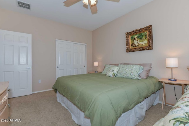 bedroom with light carpet, a closet, and ceiling fan