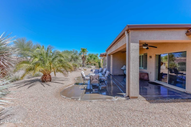 view of patio featuring ceiling fan