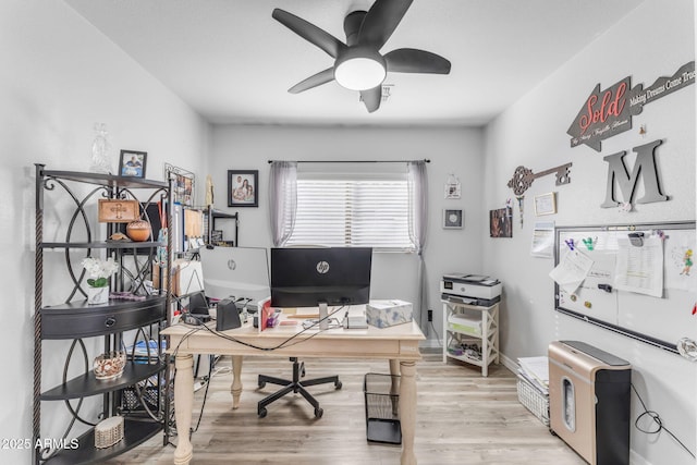 office space featuring ceiling fan and light hardwood / wood-style flooring