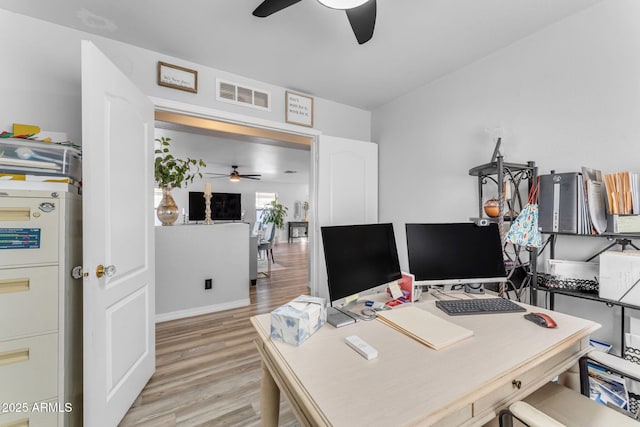 office with light hardwood / wood-style floors