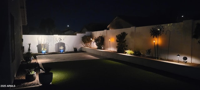 view of yard at night