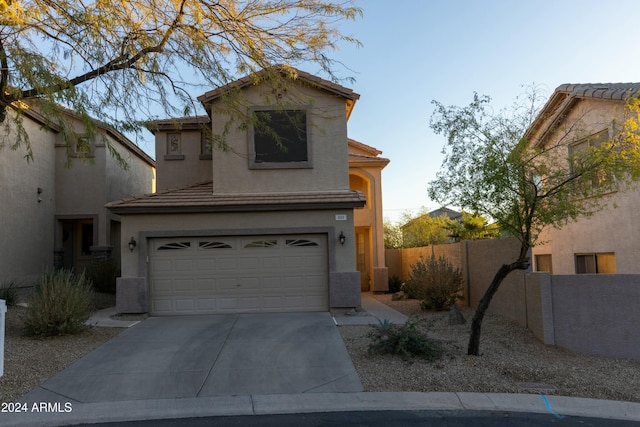 view of front of property featuring a garage