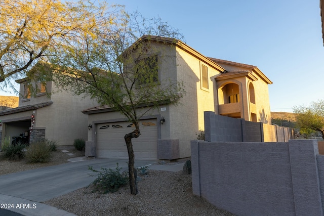 mediterranean / spanish-style house featuring a garage