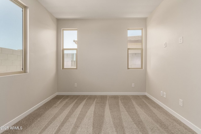 5641 N 205th Ln, Buckeye, AZ 85396 - carpeted spare room with baseboards