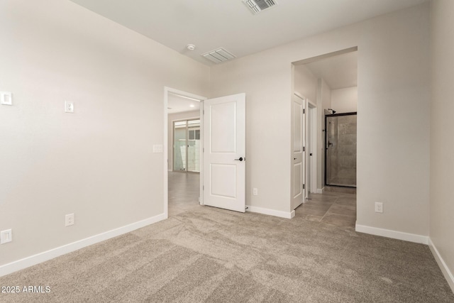 5641 N 205th Ln, Buckeye, AZ 85396 - unfurnished bedroom with carpet floors and baseboards