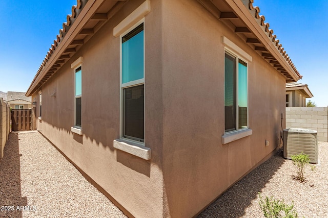 5641 N 205th Ln, Buckeye, AZ 85396 - view of home's exterior featuring central AC unit, stucco siding, and a tile roof