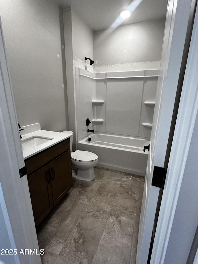5641 N 205th Ln, Buckeye, AZ 85396 - bathroom featuring vanity, bathing tub / shower combination, toilet, and stone finish floors
