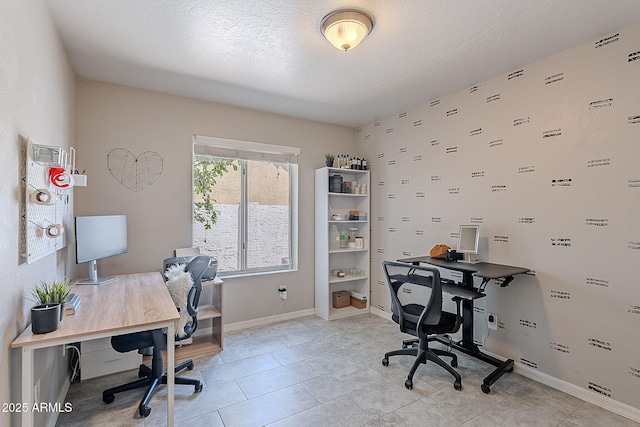 office area featuring baseboards and light tile patterned floors