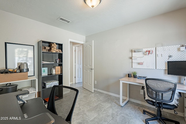 office featuring baseboards and visible vents