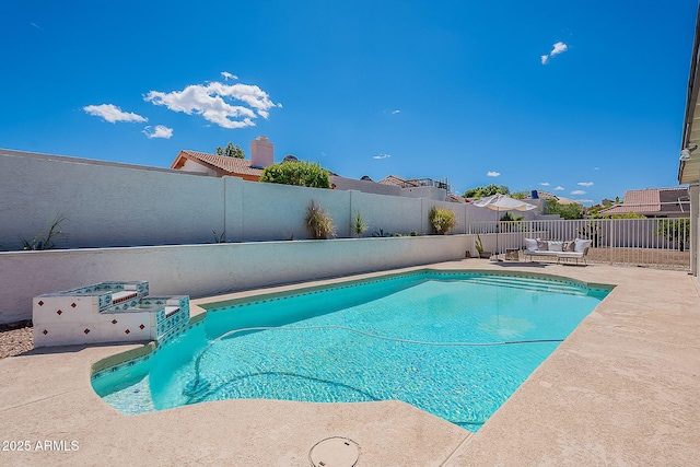 view of pool featuring a patio area, a fenced backyard, a fenced in pool, and outdoor lounge area