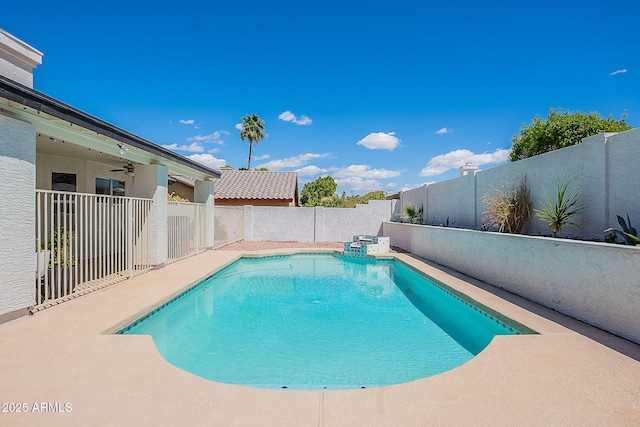view of swimming pool with a ceiling fan, a fenced backyard, a fenced in pool, and a patio