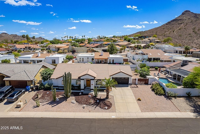 bird's eye view with a residential view and a mountain view