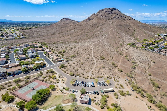 bird's eye view with a residential view, view of desert, and a mountain view