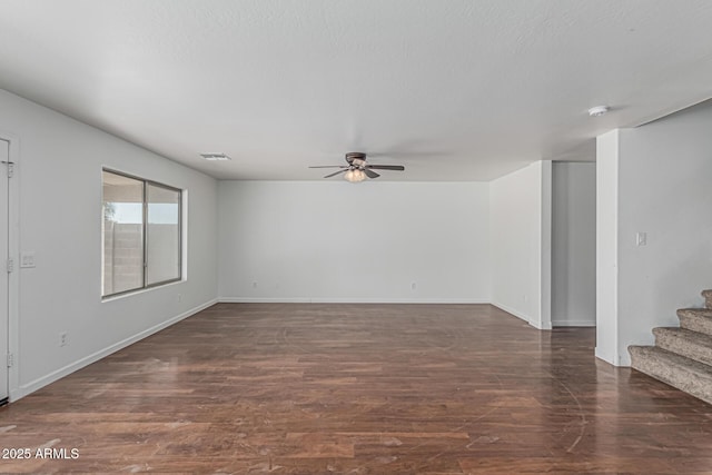 23637 N Desert Dr, Florence, AZ 85132 - spare room with ceiling fan, stairway, wood finished floors, and baseboards