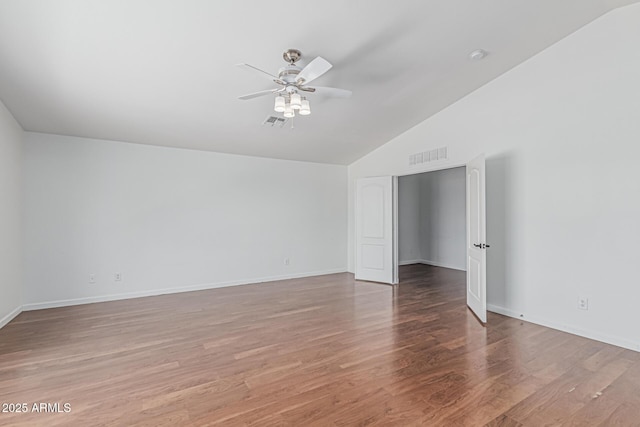 23637 N Desert Dr, Florence, AZ 85132 - spare room with vaulted ceiling, ceiling fan, light wood-style floors, and baseboards