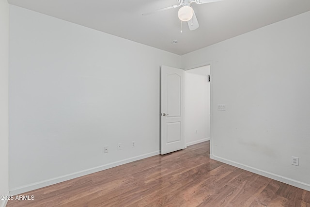 23637 N Desert Dr, Florence, AZ 85132 - empty room with light wood-style flooring, a ceiling fan, and baseboards