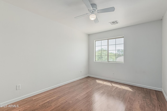 23637 N Desert Dr, Florence, AZ 85132 - unfurnished room featuring wood finished floors, baseboards, and a ceiling fan