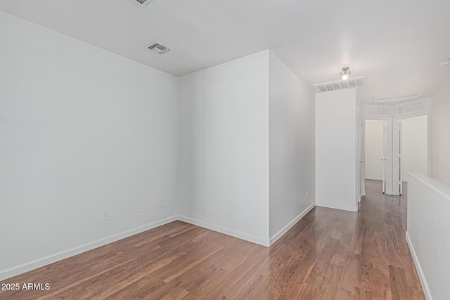 23637 N Desert Dr, Florence, AZ 85132 - empty room with wood finished floors and baseboards