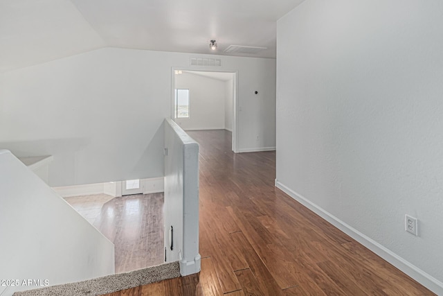 23637 N Desert Dr, Florence, AZ 85132 - corridor featuring an upstairs landing, baseboards, wood finished floors, and vaulted ceiling