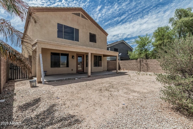 23637 N Desert Dr, Florence, AZ 85132 - back of property featuring stucco siding, a patio, and a fenced backyard