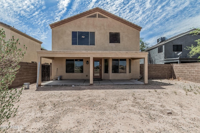 23637 N Desert Dr, Florence, AZ 85132 - rear view of property featuring stucco siding, a fenced backyard, and a patio area