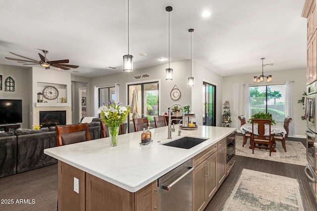 3331 N Acacia Way, Buckeye, AZ 85396 - kitchen with a sink, dishwasher, ceiling fan, dark wood-type flooring, and open floor plan
