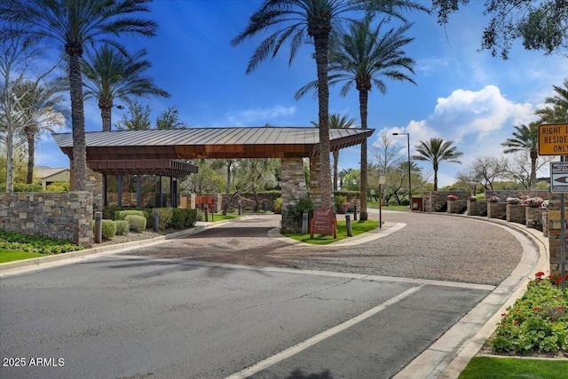 28247 N 128th Dr, Peoria, AZ 85383 - view of road with street lighting, a gated entry, and curbs