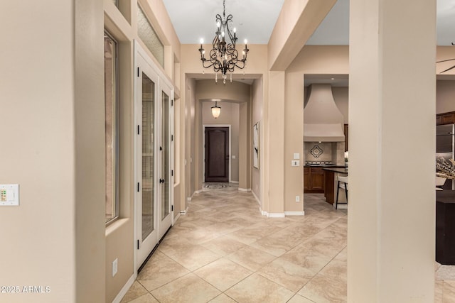 28247 N 128th Dr, Peoria, AZ 85383 - corridor with a notable chandelier and baseboards