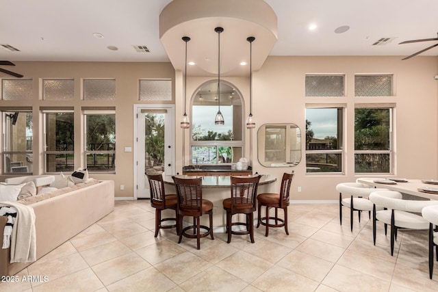 28247 N 128th Dr, Peoria, AZ 85383 - dining space featuring light tile patterned floors, ceiling fan, and visible vents
