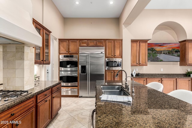 28247 N 128th Dr, Peoria, AZ 85383 - kitchen featuring custom range hood, backsplash, built in appliances, a sink, and a warming drawer
