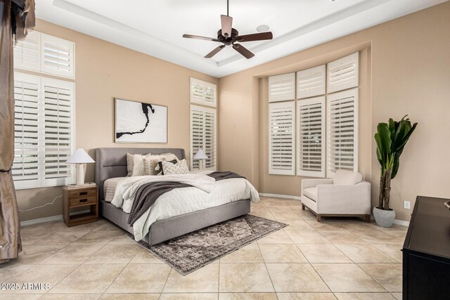 28247 N 128th Dr, Peoria, AZ 85383 - bedroom featuring a raised ceiling, baseboards, and light tile patterned floors