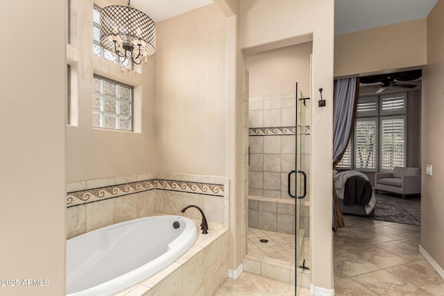 28247 N 128th Dr, Peoria, AZ 85383 - ensuite bathroom with connected bathroom, a bath, tile patterned floors, a stall shower, and an inviting chandelier