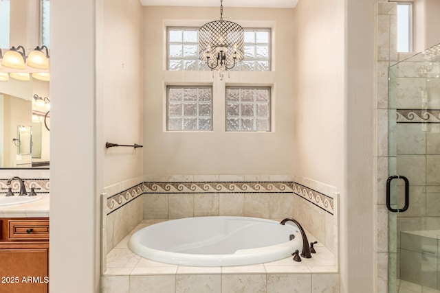 28247 N 128th Dr, Peoria, AZ 85383 - full bath featuring a notable chandelier, a shower stall, vanity, and a bath