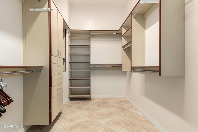 28247 N 128th Dr, Peoria, AZ 85383 - walk in closet with light tile patterned flooring