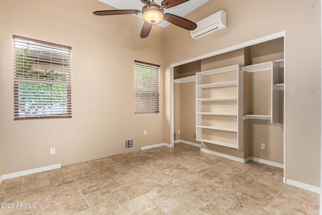 28247 N 128th Dr, Peoria, AZ 85383 - unfurnished bedroom with an AC wall unit and baseboards