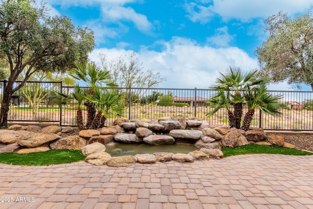 28247 N 128th Dr, Peoria, AZ 85383 - exterior space featuring a small pond and fence