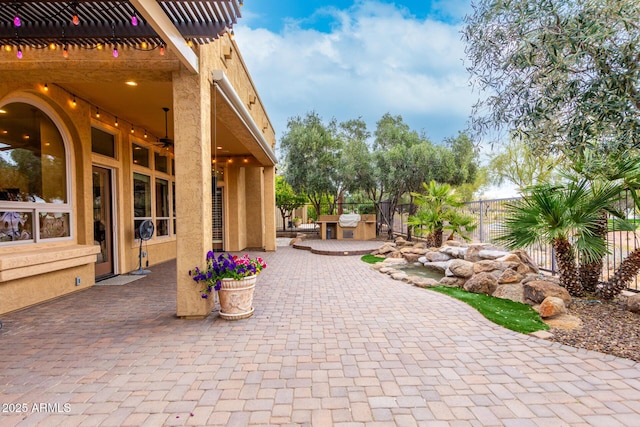 28247 N 128th Dr, Peoria, AZ 85383 - view of patio featuring ceiling fan, area for grilling, fence, and a pergola