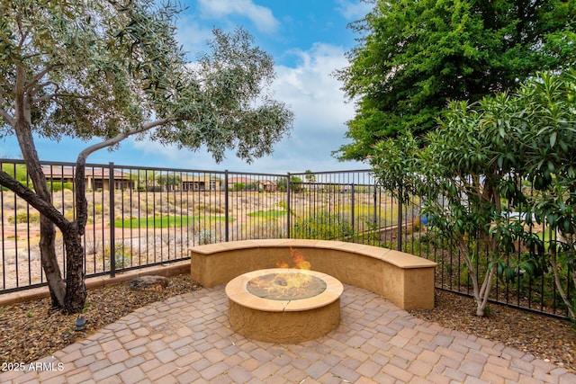 28247 N 128th Dr, Peoria, AZ 85383 - view of patio with an outdoor fire pit and fence