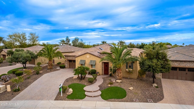28247 N 128th Dr, Peoria, AZ 85383 - view of front of property featuring an attached garage, a tiled roof, decorative driveway, and stucco siding