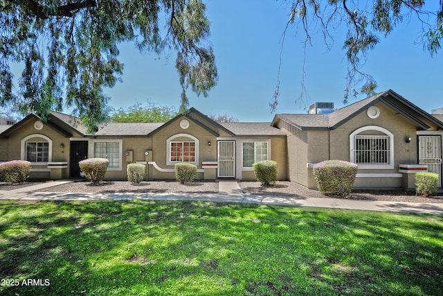 6711 W Osborn Rd Unit 82, Phoenix, AZ 85033 - ranch-style home featuring a front lawn and stucco siding