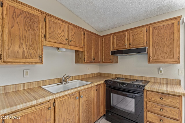 6711 W Osborn Rd Unit 82, Phoenix, AZ 85033 - kitchen with black range with electric cooktop, under cabinet range hood, vaulted ceiling, a textured ceiling, and light tile patterned floors