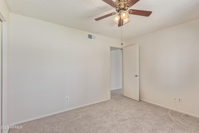 6711 W Osborn Rd Unit 82, Phoenix, AZ 85033 - spare room featuring a textured ceiling, light carpet, and a ceiling fan