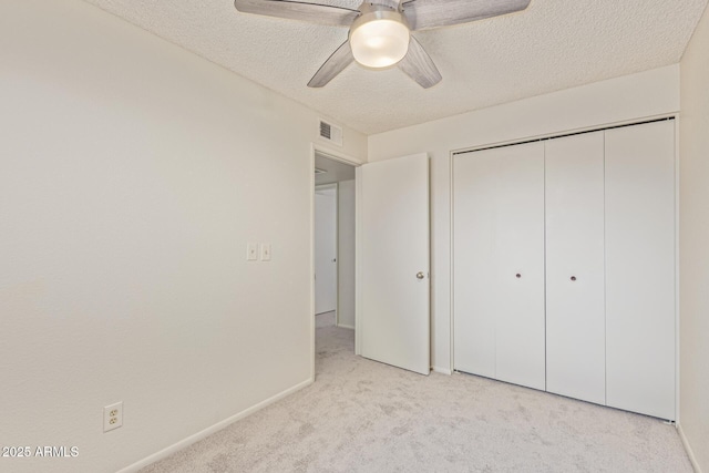 6711 W Osborn Rd Unit 82, Phoenix, AZ 85033 - unfurnished bedroom with carpet flooring, a textured ceiling, a closet, and ceiling fan