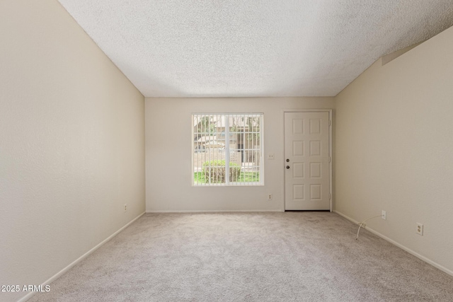 6711 W Osborn Rd Unit 82, Phoenix, AZ 85033 - carpeted empty room with a textured ceiling and baseboards