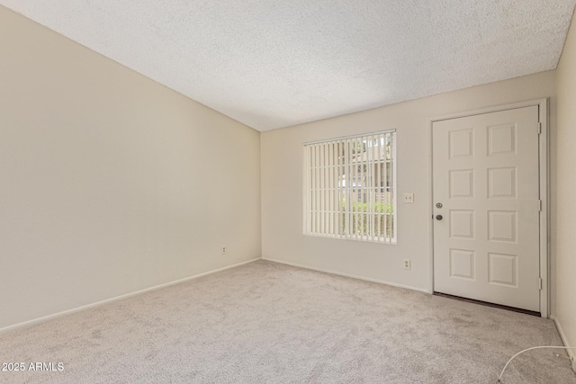 6711 W Osborn Rd Unit 82, Phoenix, AZ 85033 - foyer entrance featuring carpet and a textured ceiling