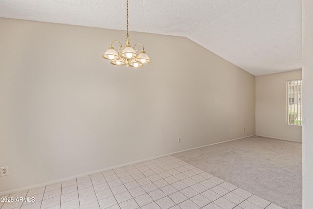 6711 W Osborn Rd Unit 82, Phoenix, AZ 85033 - unfurnished room with lofted ceiling, a chandelier, light colored carpet, and a textured ceiling