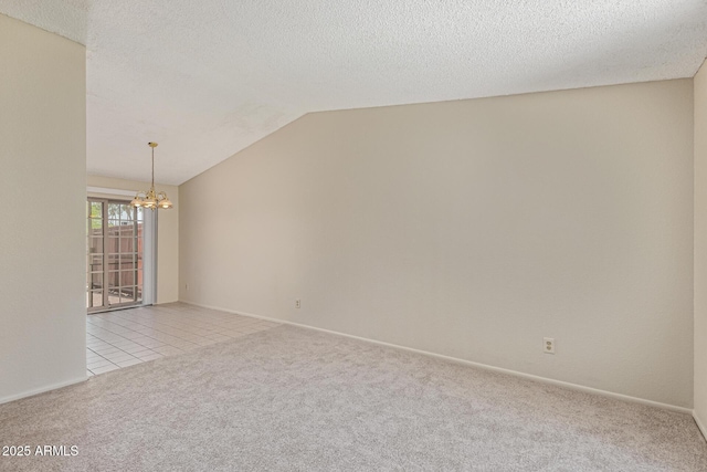 6711 W Osborn Rd Unit 82, Phoenix, AZ 85033 - carpeted empty room with a chandelier, lofted ceiling, and a textured ceiling
