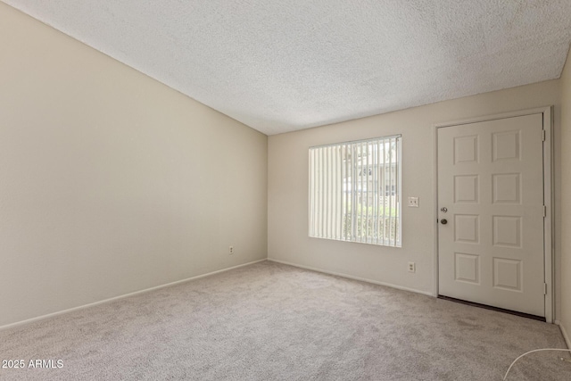 6711 W Osborn Rd Unit 82, Phoenix, AZ 85033 - foyer featuring carpet flooring and a textured ceiling