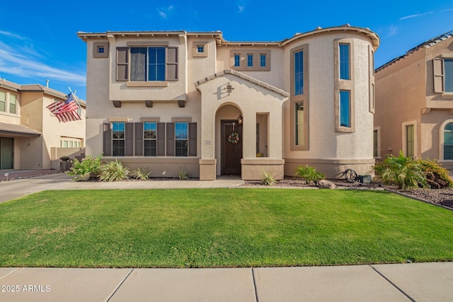 5628 N Rattler Way, Litchfield Park, AZ 85340 - mediterranean / spanish-style home featuring a front yard and stucco siding