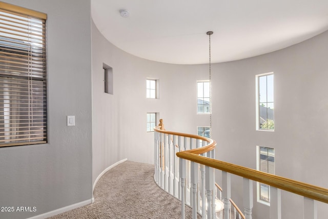 5628 N Rattler Way, Litchfield Park, AZ 85340 - hall with an upstairs landing, carpet flooring, and baseboards